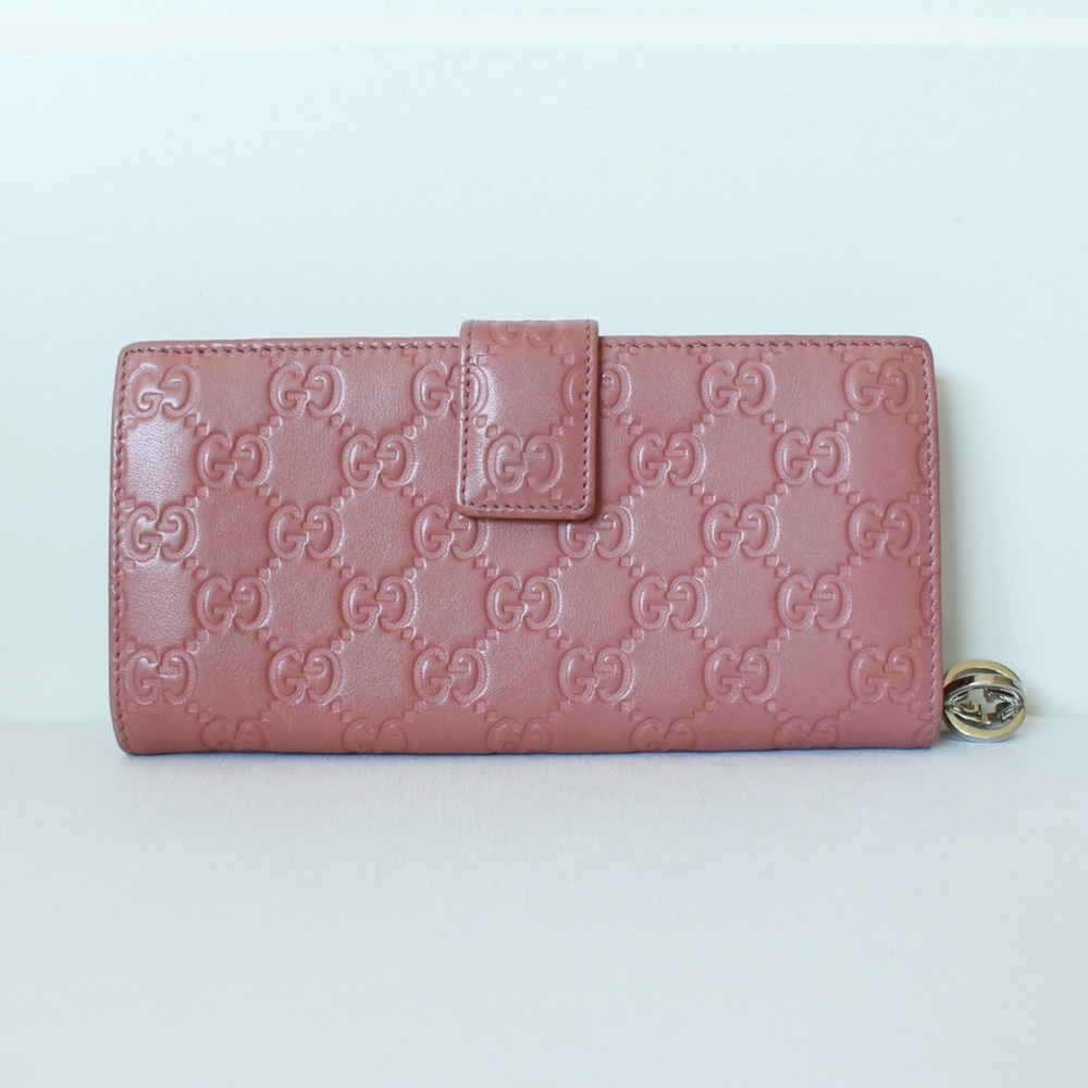 GUCCI Pink “Guccissima” Embossed Leather Wallet